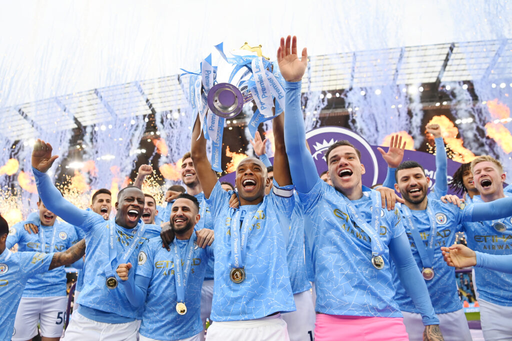 Photo of Fernandinho of Manchester City lifting the Premier League Trophy with team mates at Etihad Stadium on May 23, 2021