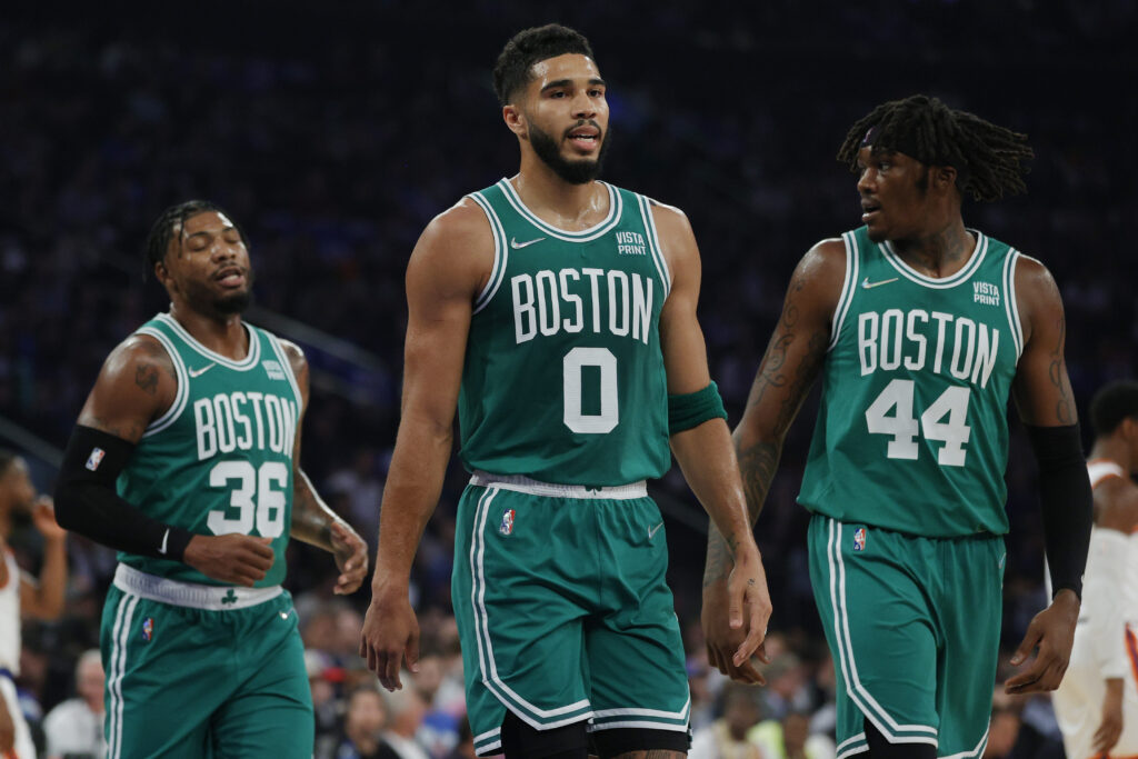 Marcus Smart #36, Jayson Tatum #0, and Robert Williams III #44 of the Boston Celtics look on during the first half against the New York Knicks at Madison Square Garden on October 20, 2021 in New York City.