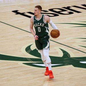 Donte DiVincenzo #0 of the Milwaukee Bucks dribbles the ball in the first quarter against the San Antonio Spurs at the Fiserv Forum on March 20, 2021 in Milwaukee, Wisconsin.