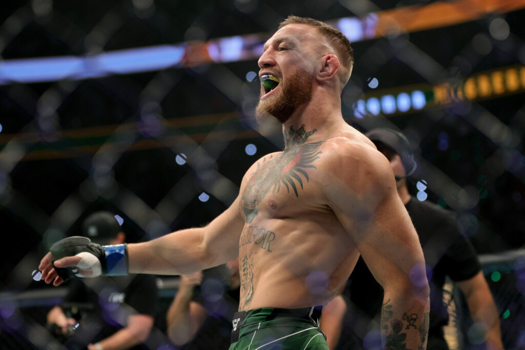 Conor McGregor walks in the octagon before his lightweight bought against Dustin Poirier during UFC 264