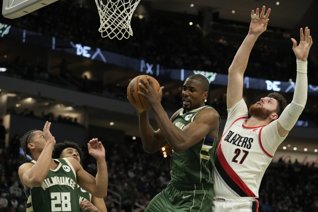 Serge Ibaka #25 of the Milwaukee Bucks rebounds the ball against Jusuf Nurkic #27 of the Portland Trail Blazers during the second half at Fiserv Forum on February 14, 2022 in Milwaukee, Wisconsin.