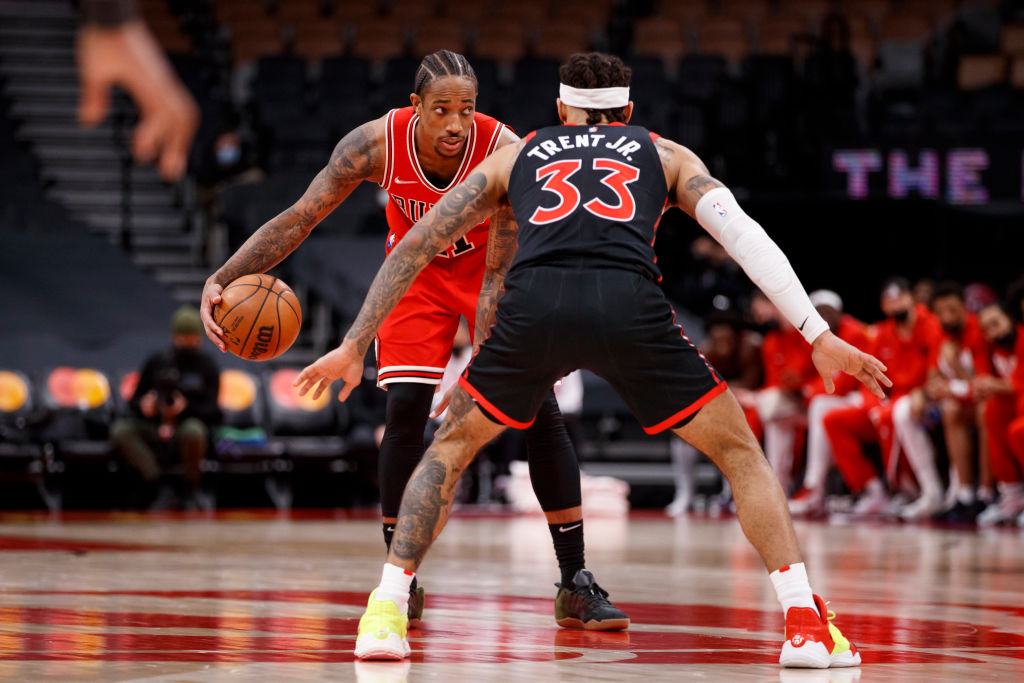 DeMar DeRozan #11 of the Chicago Bulls dribbles against Gary Trent Jr. #33 of the Toronto Raptors during the second half of their NBA game  at Scotiabank Arena on February 3, 2022 in Toronto, Canada.